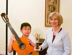 Guitar teacher Lynn Ware with Guitar Student Nicolas Lee winner of the North Yourk Music Festivel Best Junior Guitarist trophy